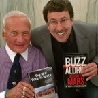 Eric Knight and Buzz Aldrin exchange signed copies of their books